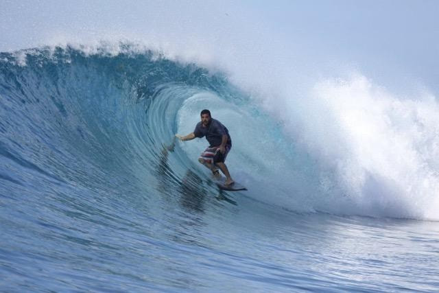 Owner and Instructor, John, of Polu Lani Surf inside a barrel of a large wave. Provided by Polu Lani Surf